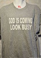 Front of grey slogan T-shirt showing size XL and text