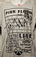 Front view of grey Pink Floyd The Wall Live In Concert graphic T-shirt, size XL tag location indicated