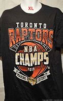Front view of black Toronto Raptors NBA Champions 2019 men’s XL T-shirt