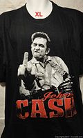 Front view of black T-shirt displaying Johnny Cash graphic and size reference XL