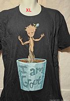 Front view of black Groot graphic T-shirt, size XL visible