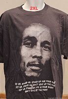 Front view showing Bob Marley portrait graphic and text, size label 2XL