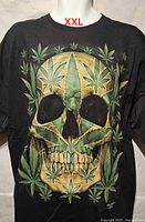 Front view showing full skull and cannabis leaf graphic and size reference