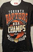 Front view of T-shirt showing full championship graphic and size indicator