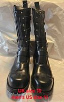 Front view of pair of tall black leather boots