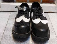 Front view of pair showing toe caps and lacing