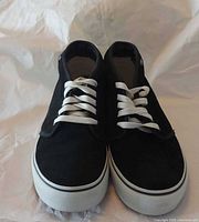 Front view of both shoes showing uppers, laces, and toe caps