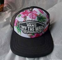 Front view showing floral print front panel, Vans Off The Wall logo, black bill