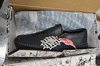 Shoes in original Marvel-themed Vans box with tissue paper and tags