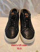 Front view of both sneakers showing uppers and size text