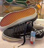 Bottom and side view showing gum waffle outsole and upper details