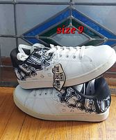 Side view of both shoes showing graphic uppers and size label