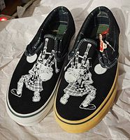 Top view of both shoes showing graphics and color details