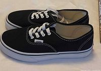 Side view of both shoes showing uppers, laces, and sole