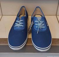 Top view of both sneakers showing uppers and laces