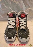 Front view of both sneakers showing condition, colour, laces, branding, size text overlay