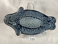 Top view of seal-shaped serving dish showing full form and glaze pattern