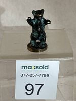 Full view of bronze bear figurine on base with lot number