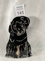 Front view of black lab puppy vase