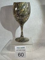 Front view of Fishouflage Bass wine goblet on clear stand