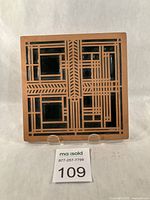 Front view of square tile trivet showing full Willits Skylight pattern