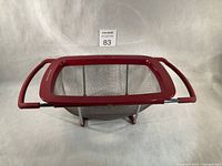 Top view of colander showing mesh basket and red trim