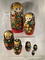 Full set of seven nesting dolls displayed by size