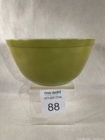 Side view of green Pyrex mixing bowl
