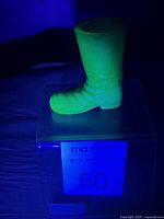 Side view glowing under UV showing boot shape