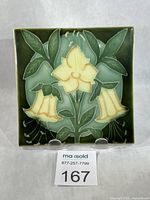 Front view of tile showing full Art Nouveau floral design