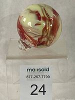 Front view showing swirl pattern and hanging loop