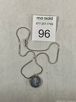 Full view of pendant and chain with lot tag