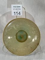 Top view of yellow crystalline glazed porcelain bowl on stand