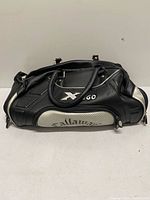 Front view of Callaway X-460 duffel showing main compartment, logo, handles, shoulder strap