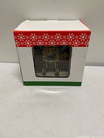 Front of boxed lighted shoe shop building