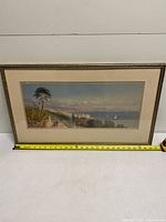 Front view showing framed print and measuring tape indicating width ~27"