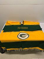Front view showing PACKERS text, team logo, neck opening