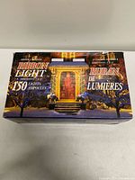 Front of box displaying product name, usage imagery, 150 bulb count