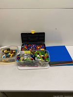 Overall view of three containers and stack of baseplates