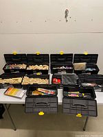 Overall view of eight loaded ToolBench tool boxes on table