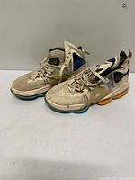 Full view of both shoes showing overall design and wear