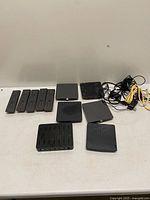 Group shot of remotes, streaming boxes, charging hub and cables