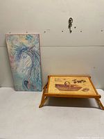 Full view of painting and bed tray