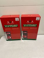 Front view of two sealed boxes of 10-count string lights