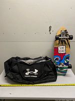 Overall view of duffle bag and skateboard