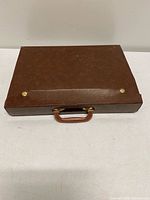 Closed brown hard carrying case