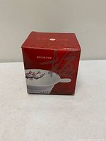 Front view of TenRen red gift box showing product image and branding
