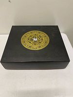 Closed black presentation box on table