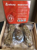 Open Willjoy box showing two log chew bones and one ball, all sealed