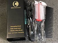 Boxed Brushzoo 3-piece detangling brush, 9-row brush and comb set